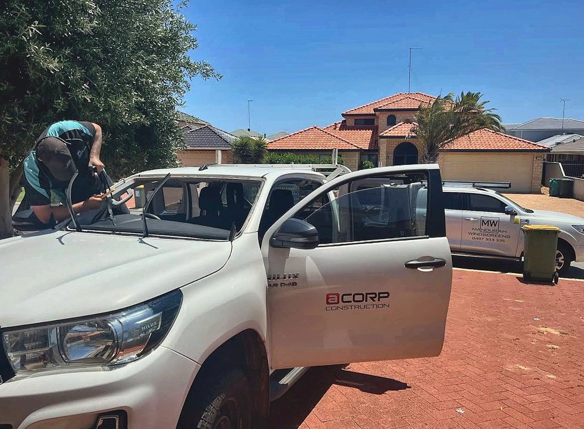 Daniel fitting a new windscreen to a Toyota Hilux